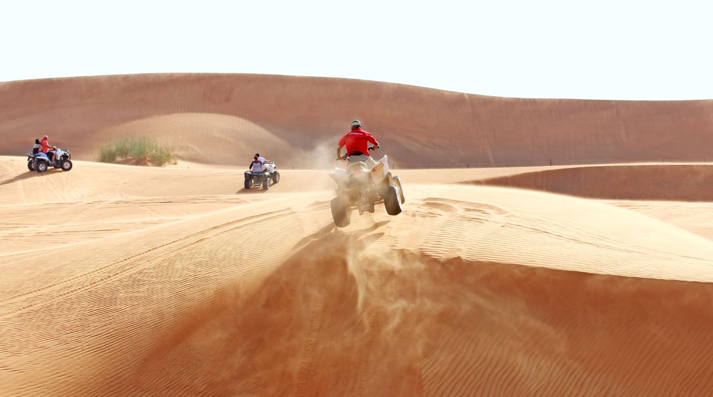 atv jumping on sand dune